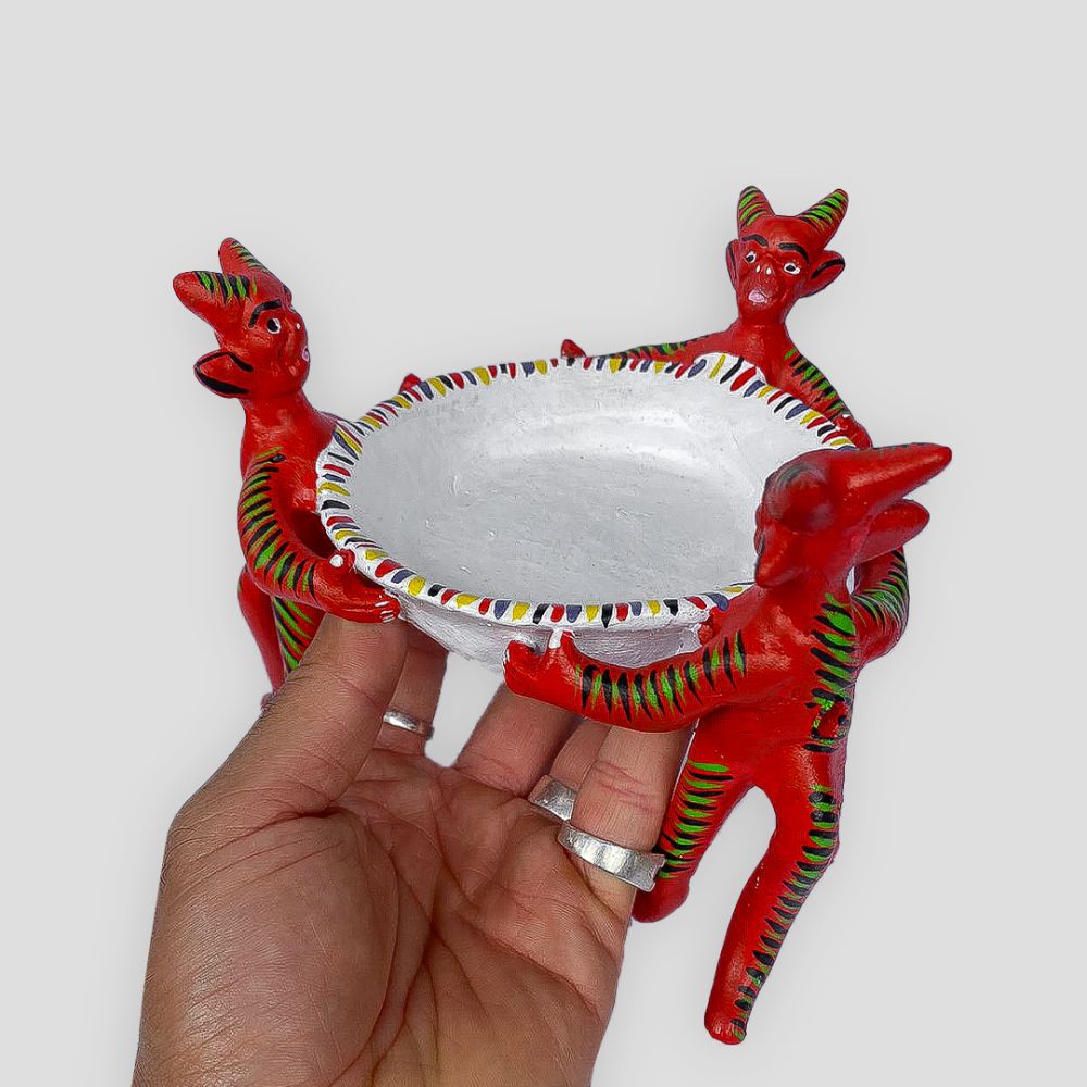 Little devils holding plate